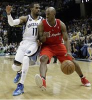 Chauncey Billups drives inside against Mike Conley.JPG