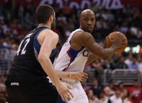 Chauncey Billups keeps the ball away from Kevin Love.JPG