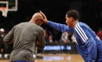 Chauncey Billups sees Trey Thompkins putting a hand in his face during practice.JPG