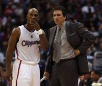 Chauncey Billups talks to coach Vinny Del Negro.JPG