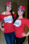 Two Latina Clipper fans in red Clipper hats and shirts