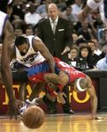 Maggette and Artest fight for the loose ball.jpg