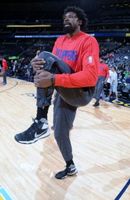 DeAndre Jordan Stretches His Left Thigh During Warm Ups in Denver
