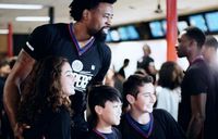 DeAndre Jordan and Young Clipper Fans 2016 Jeff Green in the Background