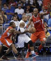 Eric Bledsoe tries to poke the ball away from Jameer Nelson.JPG