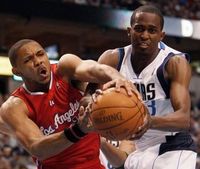 Eric Gordon battles Beaubois for the loose ball.JPG