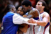 Eric Gordon is embraced by Craig Smith DeAndre Jordan and Blake Griffin.JPG