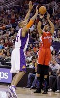 Eric Gordon launches a 3 over Grant Hill.JPG
