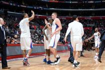Clipper Teammates High-Five Each Other at Staples Center 2016 with Lawrence Frank Looking on