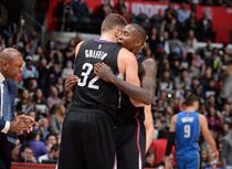 Clipper Teammates Jamal Crawford & Blake Griffin in Black Clipper Jersies Share a Hug as Doc Rivers Clap His Hands