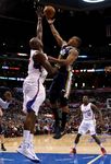 Lamar Odom challenges Randy Foye's shot.JPG