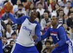 Lamar Odom receives the ball in the post vs Caron Butler during practice in China.JPG