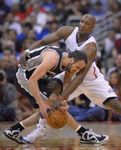 Lamar Odom tries to strip the ball from Manu Ginobilli.JPG